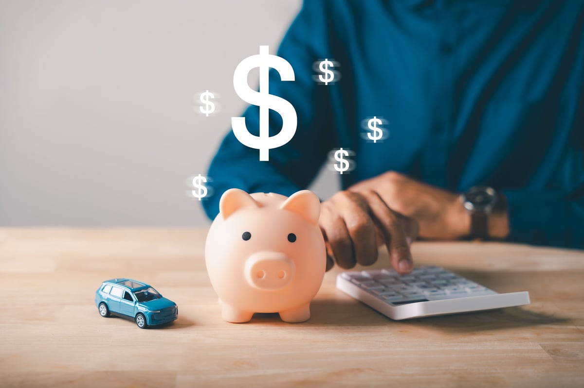 Car dealer helping customer with financing at Kris Martin Motors